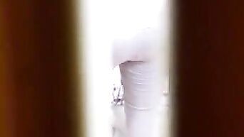 The beauty dresses, and don't know, that behind her peep