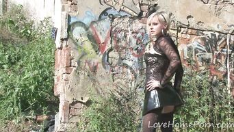 Slender blonde shows striptease on street