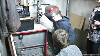 Glamor brunette fucks two workers in workshop