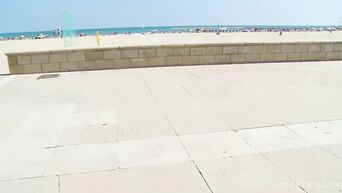 European couple is engaged in anal on beach