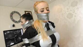 Two tied secretaries in business suits