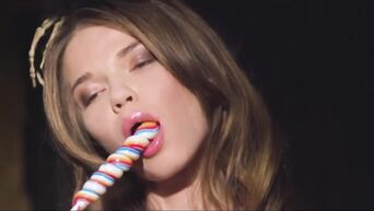 Satanic slut masturbates on altar with candles