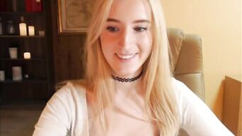 Blonde fucks herself with her finger