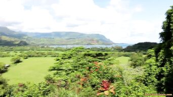 Oral caresses of young couple on beautiful island