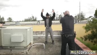 MILFs in uniform caress big black cock on the roof