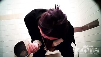 Businesswoman shows shaved pussy, unaware of spy camera in toilet
