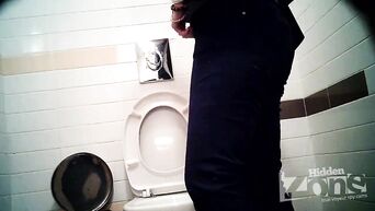 Businesswoman shows shaved pussy, unaware of spy camera in toilet