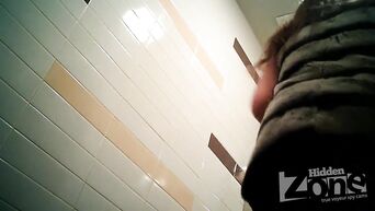 Shows shaved vagina in front of spycam in public toilet