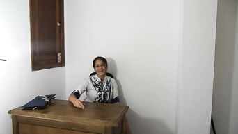 Latin MILF sexually masturbates shaven vagina, sitting on table