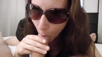 Horny dark-haired MILF in sunglasses makes deep blowjob