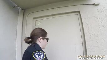 Two MILFs in police uniform bent negro to cunnilingus