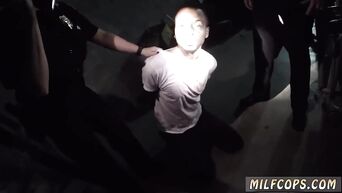 Two MILFs in police uniform bent negro to cunnilingus