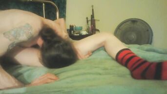 Mature woman and tattooed lover are engaged in oral sex