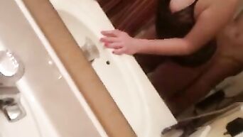 Red-haired nymph in erotic negligee fucked in front of mirror