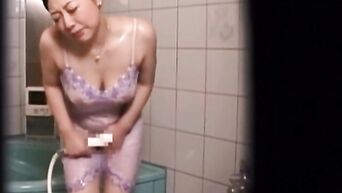Asian spycam: Japanese MILF masturbates in shower