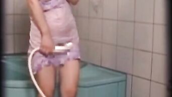Asian spycam: Japanese MILF masturbates in shower