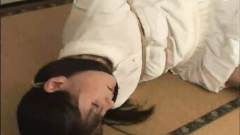 Rope-bound Japanese brunette