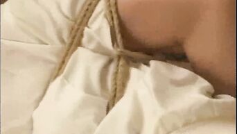 Rope-bound Japanese brunette